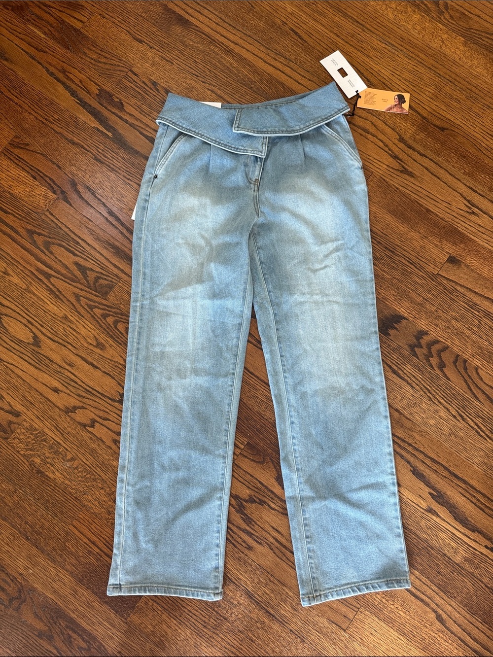 E Future Collective light wash mid rise straight leg shawl wrap waistband jeans.